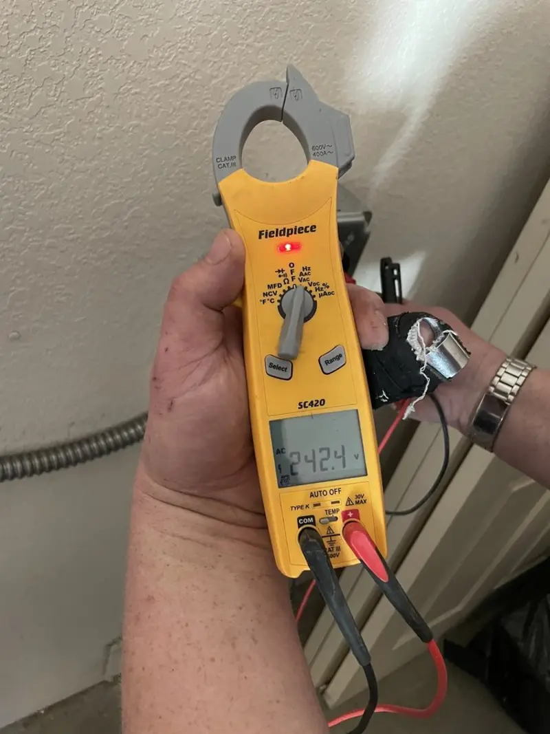 Voltage testing with clamp meter during Ceiling Fan Installation in Port Richey